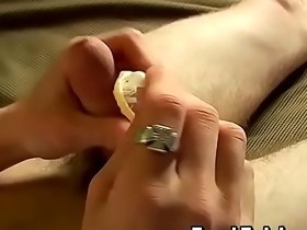 Handsome twink puts a condom on his hairy schlong and jerks
