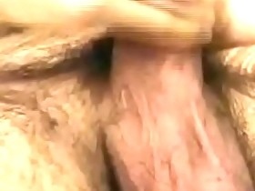 Hairy young guy tugs raging dick and cums all over the place