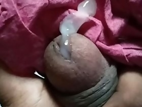 Squeezing a cum filled Indian Cock