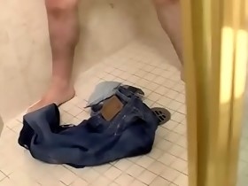 Smooth and beefy twink masturbates and pisses in a bathroom